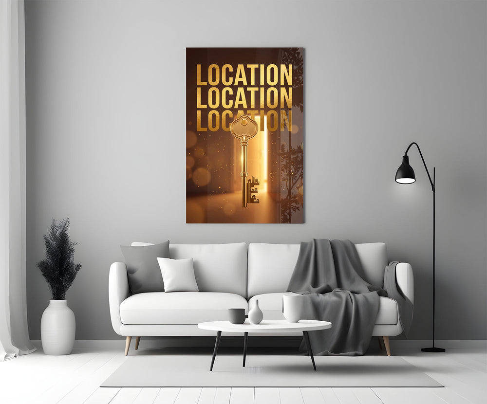 gold real estate key with a skyline panel bringing character to a minimalist living room wall