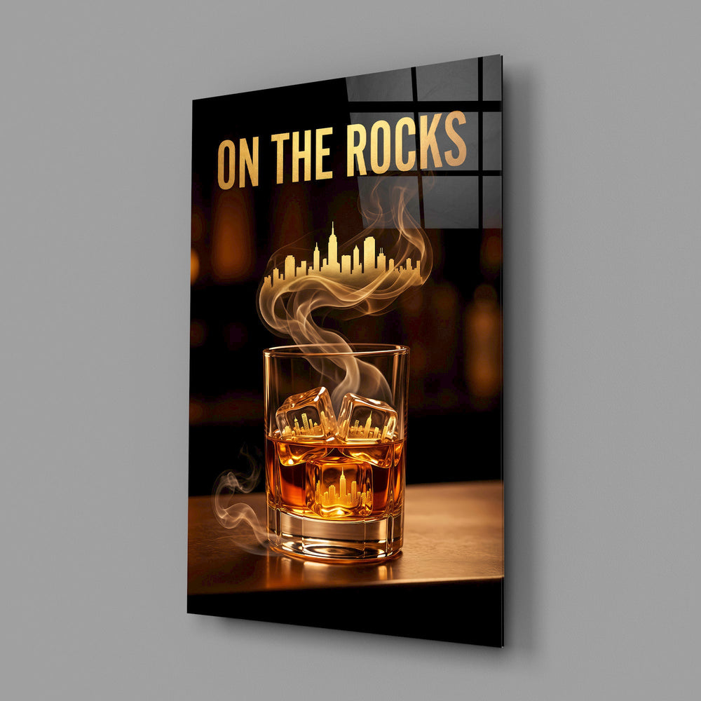 whiskey glass with a golden skyline glass wall art angled to show the polished tempered glass panel