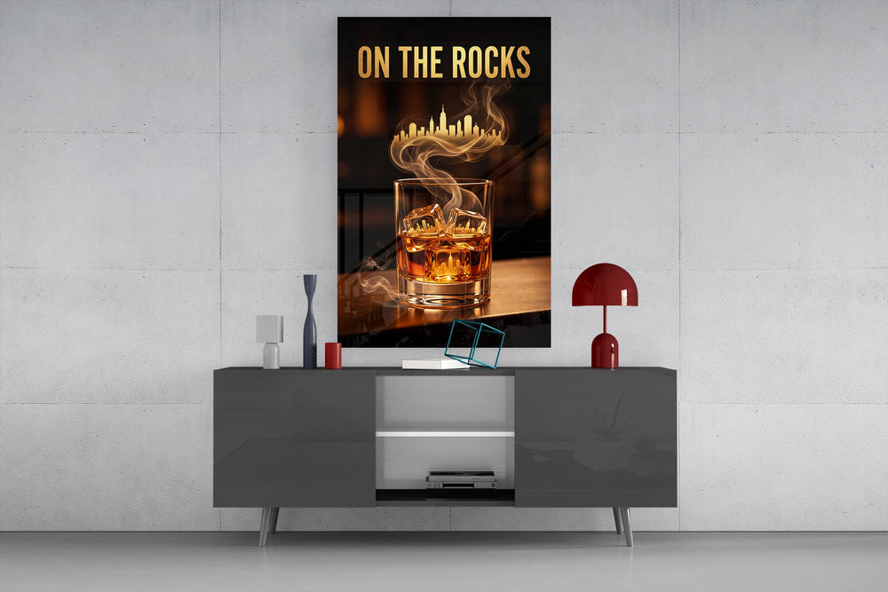 whiskey glass with a golden skyline glass wall art displayed above a console in a designer interior
