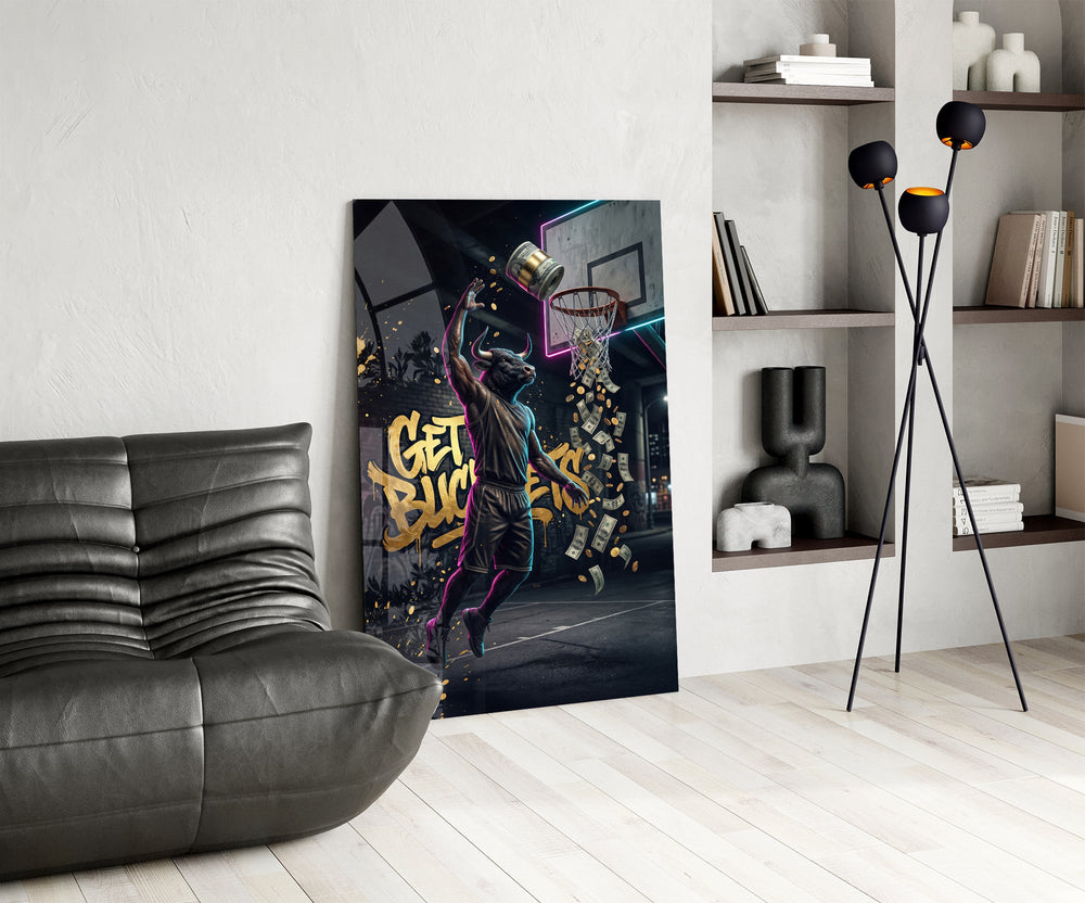 get buckets bull baller money dunk glass wall art leaning beside a dark leather sofa