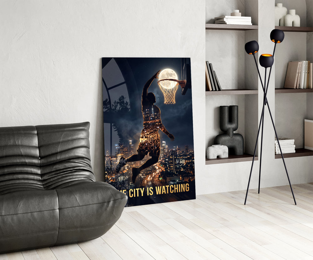 the city is watching moonlit dunk glass wall art leaning beside a dark leather sofa