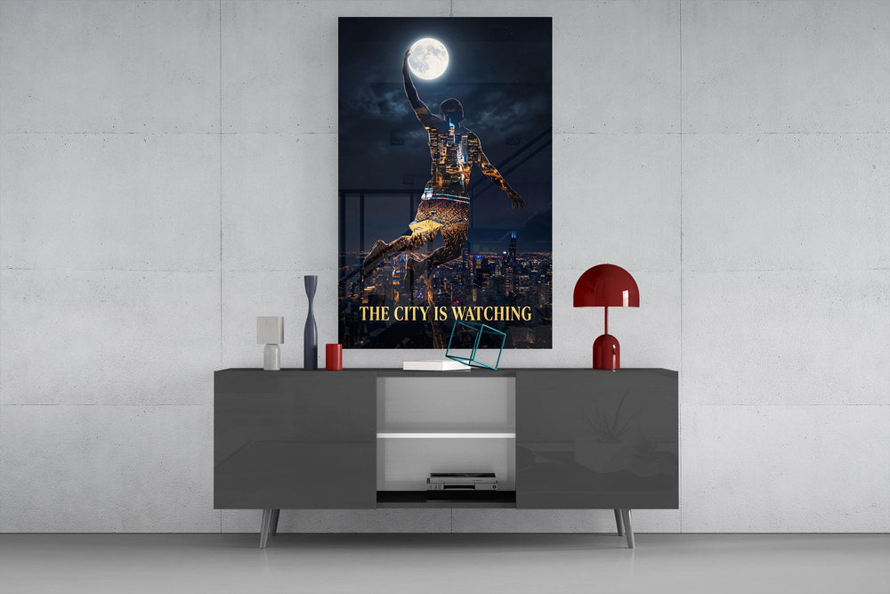 basketball player palming the moon glass wall art displayed above a console in a designer interior