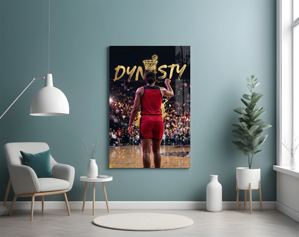 gold Dynasty basketball typography glass wall art styled above an armchair in a reading corner