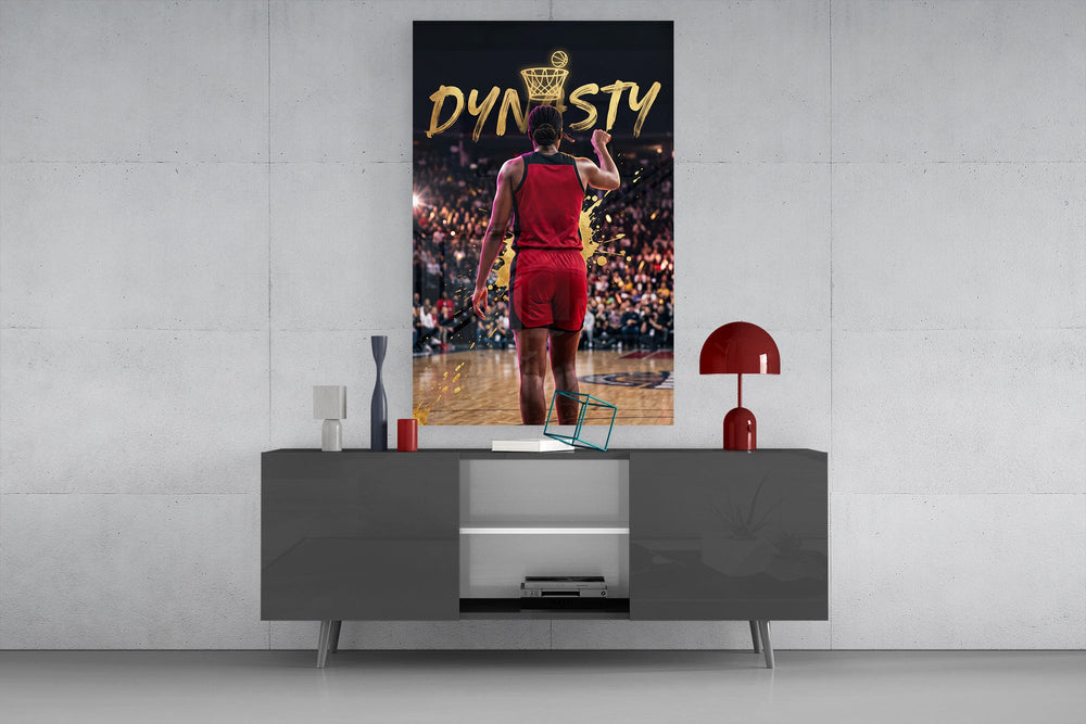 gold Dynasty basketball typography glass wall art displayed above a console in a designer interior