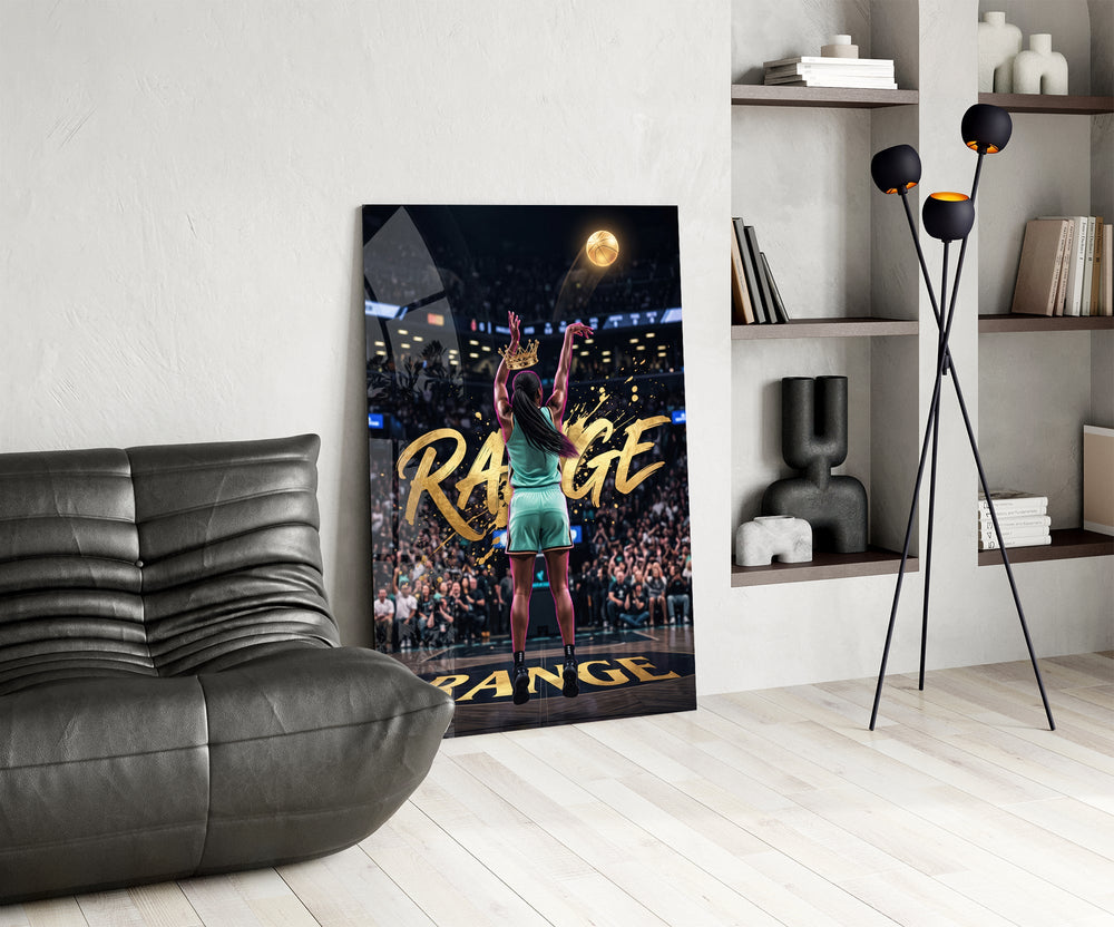 gold Range basketball shooter glass wall art leaning beside a dark leather sofa