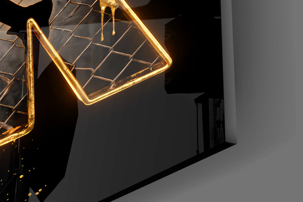 Close-up detail of the dripping gold outlines and the player silhouette inside the letters on the glass surface