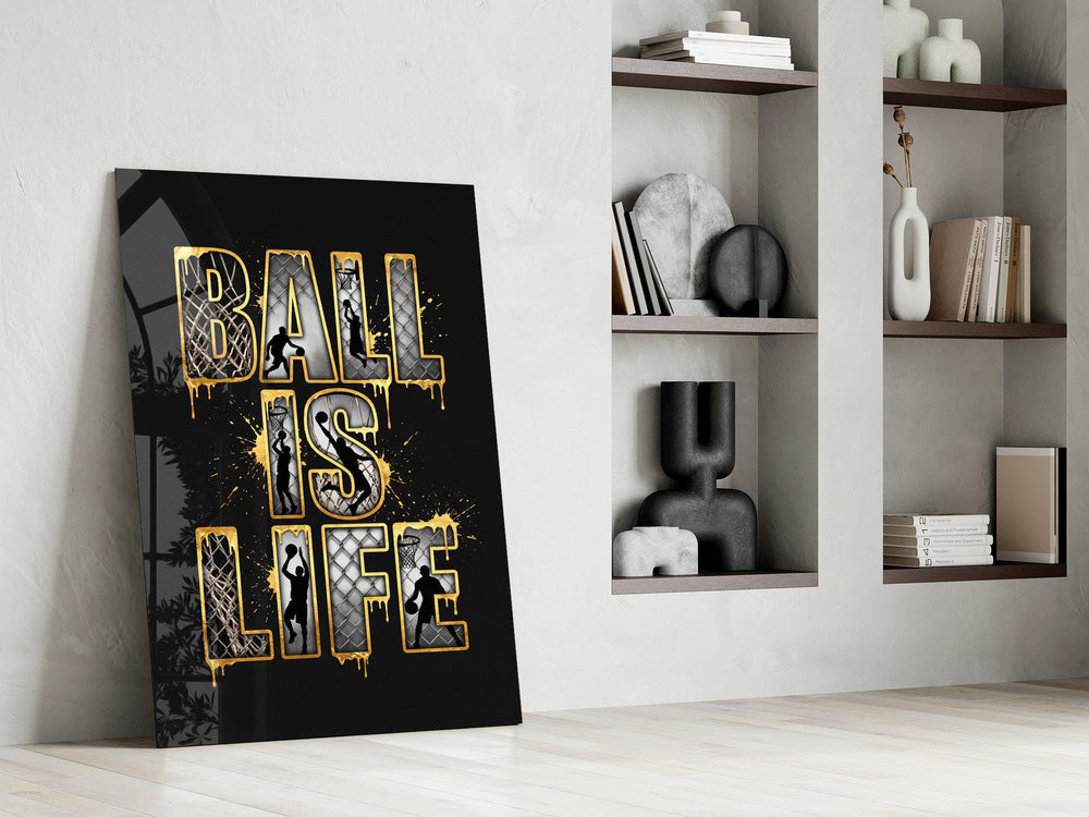 gold Ball Is Life basketball typography panel resting in a shelving niche in a modern interior