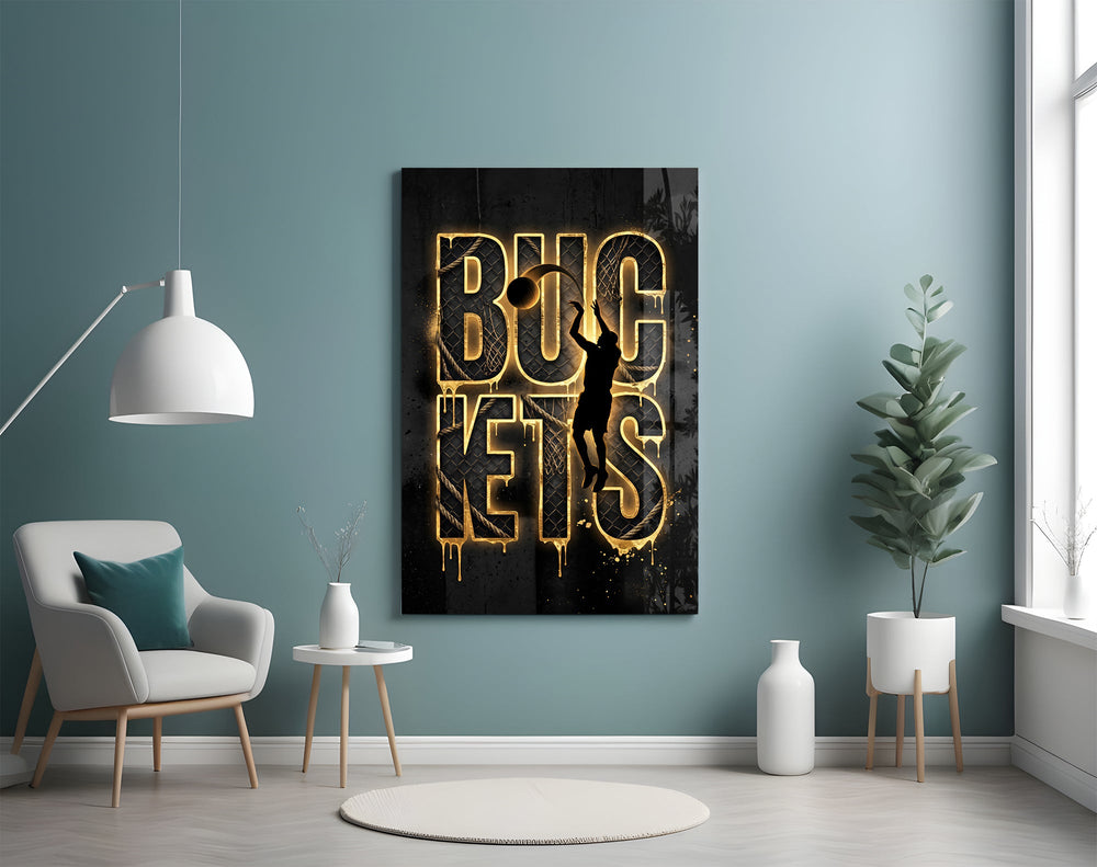 gold basketball typography with a jump-shot silhouette glass wall art styled above an armchair in a reading corner