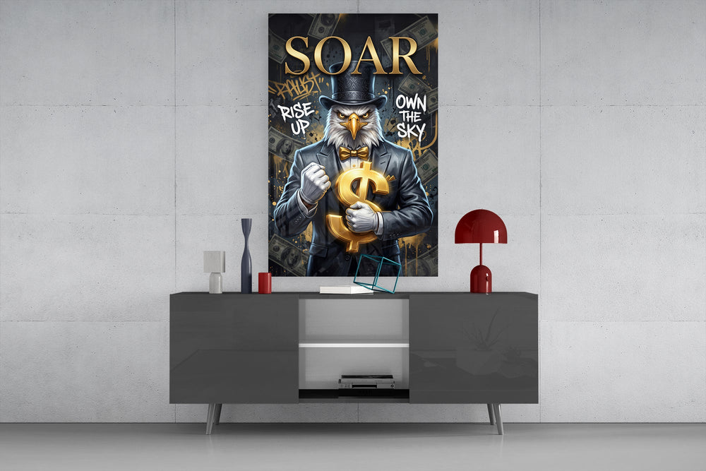 suited bald eagle holding a gold dollar sign glass wall art displayed above a console in a designer interior