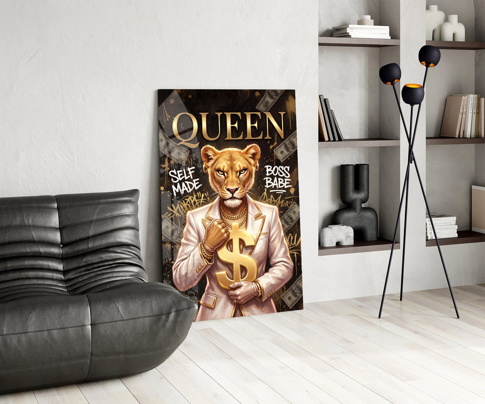 suited lioness with a gold dollar sign glass wall art leaning beside a dark leather sofa