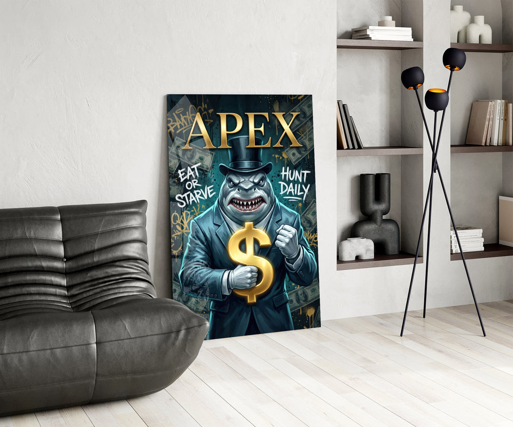 suited shark with a gold dollar sign glass wall art leaning beside a dark leather sofa