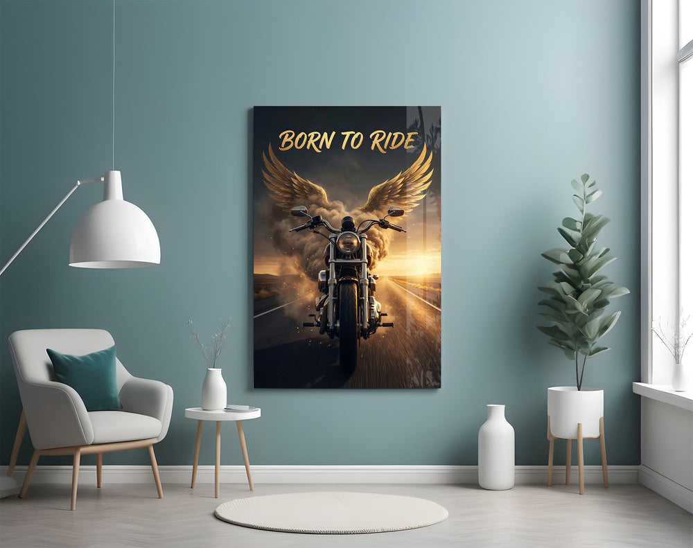 born to ride winged motorcycle glass wall art styled above an armchair in a reading corner