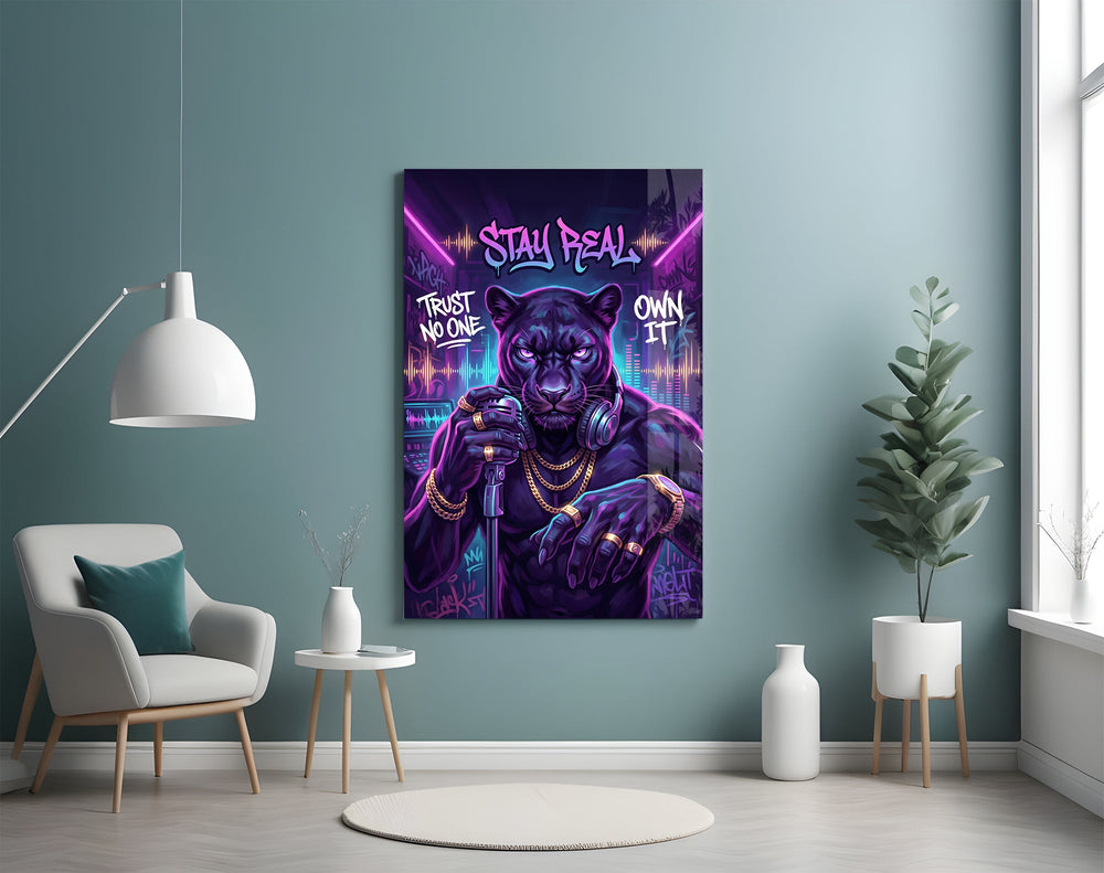stay real neon panther rapper glass wall art styled above an armchair in a reading corner
