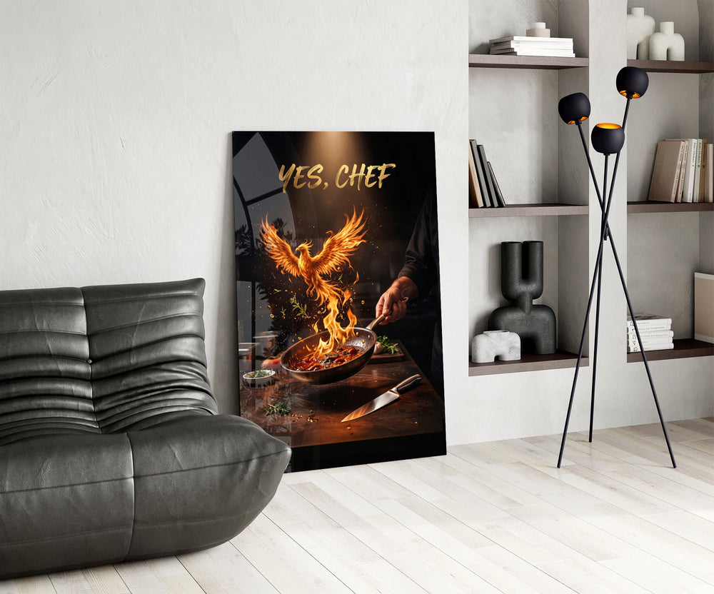 yes chef fire phoenix flaming pan glass wall art leaning beside a dark leather sofa