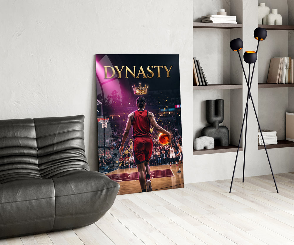 dynasty gold crown basketball king glass wall art leaning beside a dark leather sofa