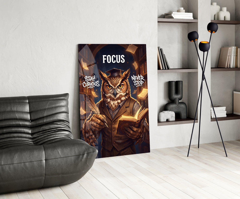 focus scholar owl professor glass wall art leaning beside a dark leather sofa