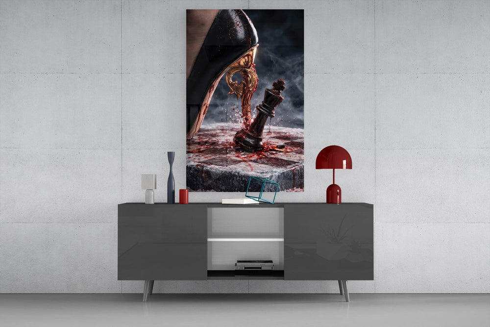 stiletto heel crushing a chess king glass wall art displayed above a console in a designer interior