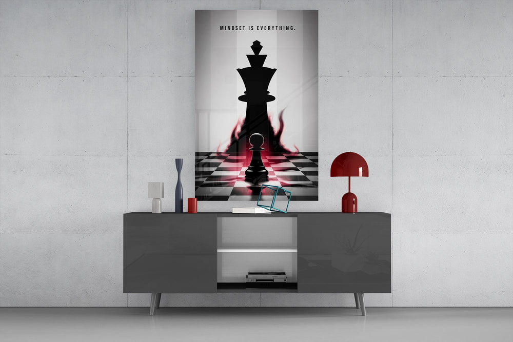 a pawn facing a king-sized shadow glass wall art displayed above a console in a designer interior