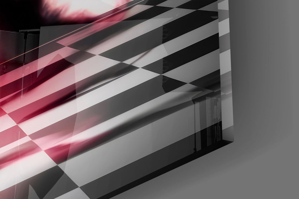 Close-up detail of the small black pawn lit red against the towering king silhouette on the glass surface