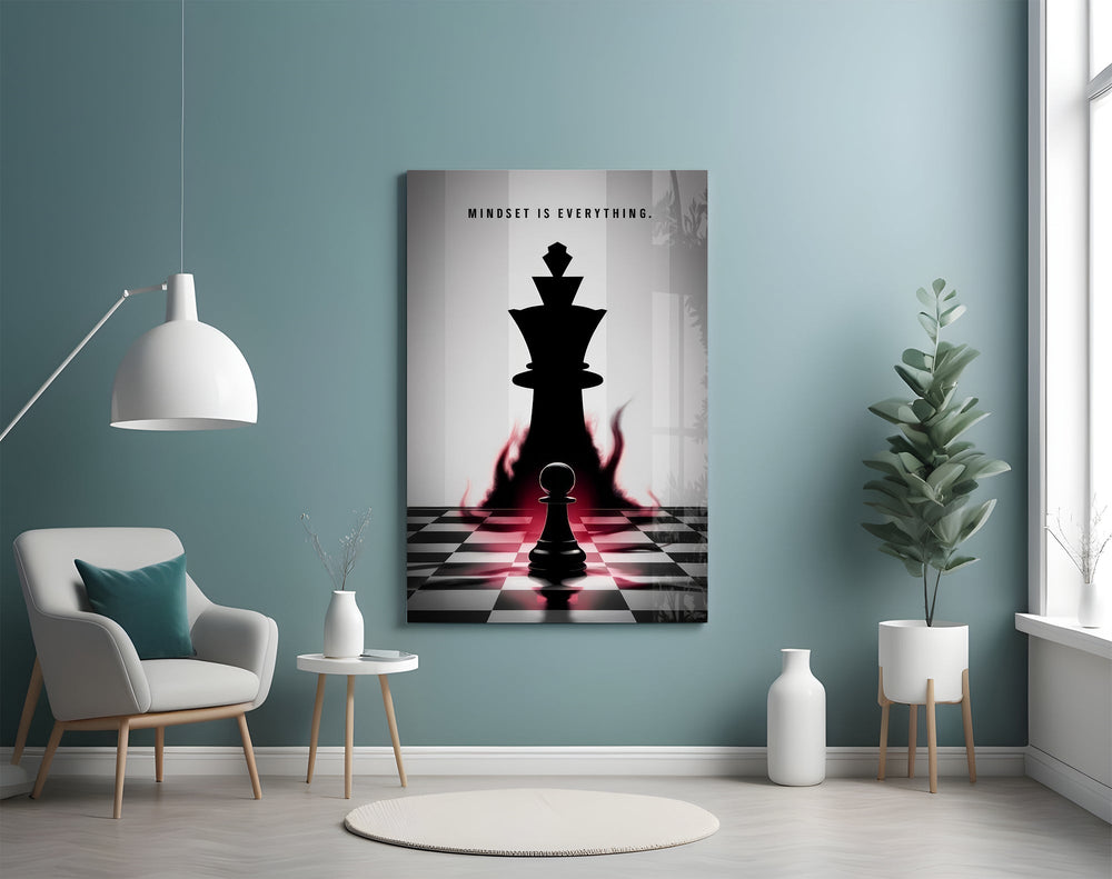 a pawn facing a king-sized shadow glass wall art styled above an armchair in a reading corner