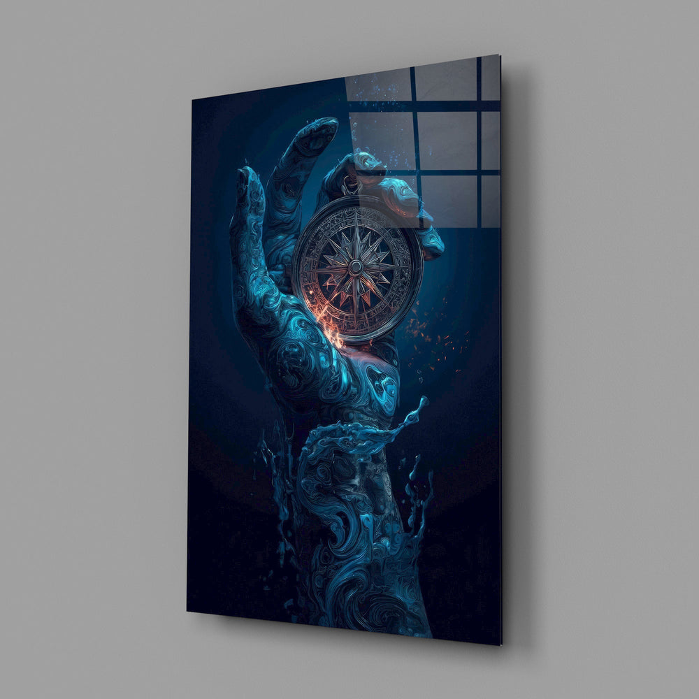 liquid water hand holding an ornate compass glass wall art angled to show the polished tempered glass panel