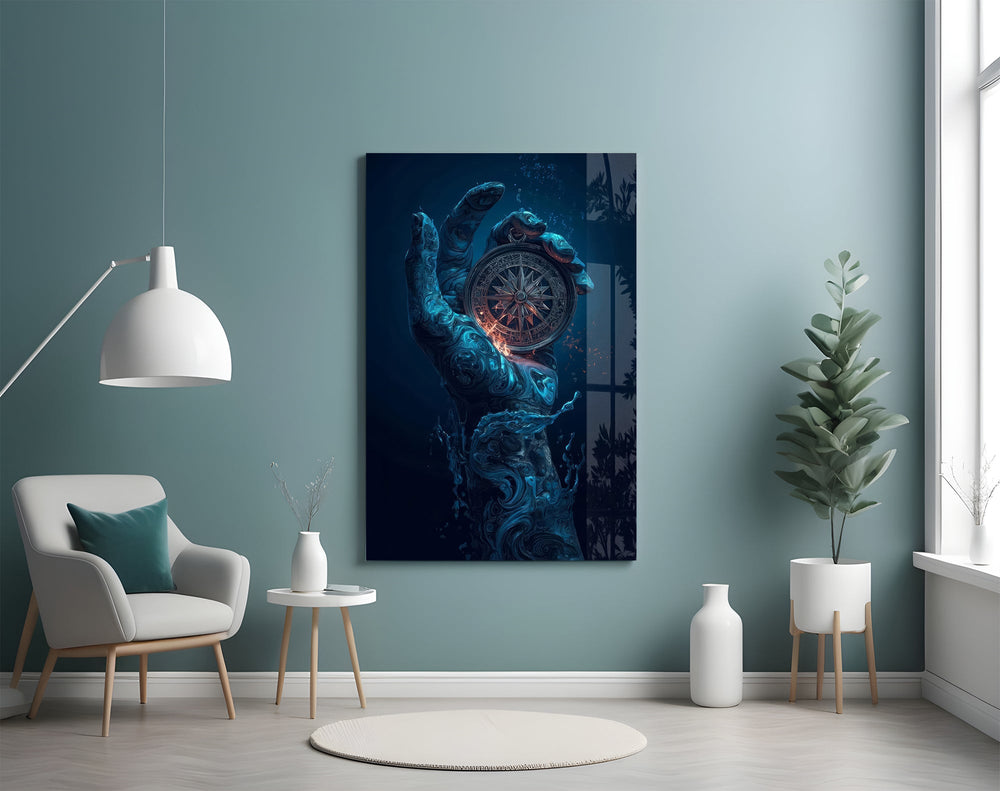 liquid water hand holding an ornate compass glass wall art styled above an armchair in a reading corner