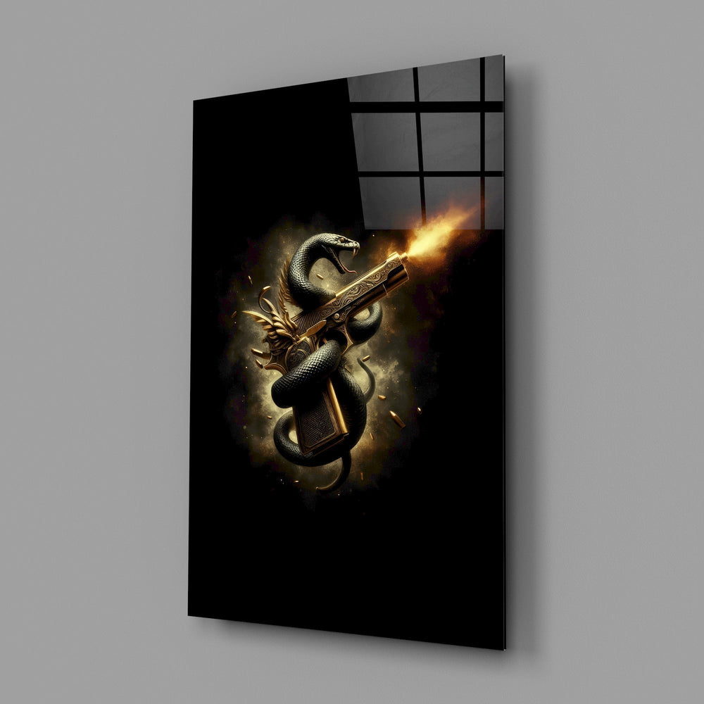 golden pistol wrapped by a black serpent glass wall art angled to show the polished tempered glass panel