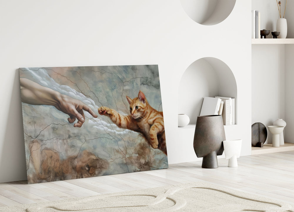 ginger kitten reaching a paw to a human hand panel bringing character to a minimalist living room wall