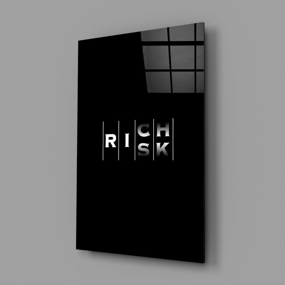 interlocking rich and risk typography glass wall art angled to show the polished tempered glass panel
