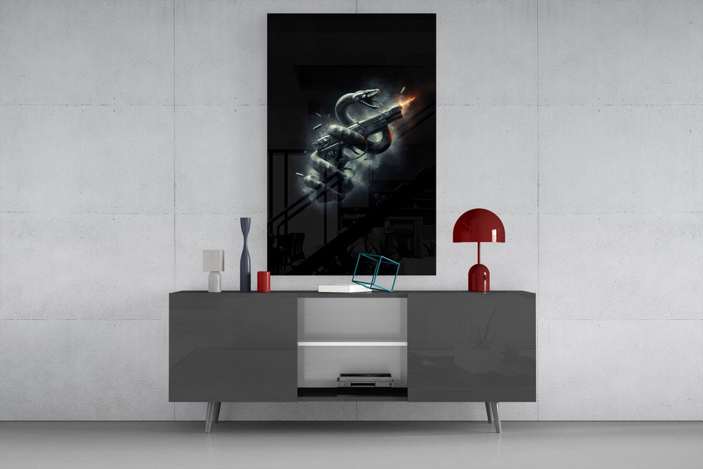 a serpent coiled around a firing pistol glass wall art displayed above a console in a designer interior