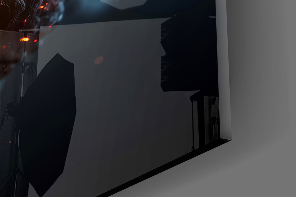 Close-up detail of the cracked embers and orange glow between the fingers on the glass surface