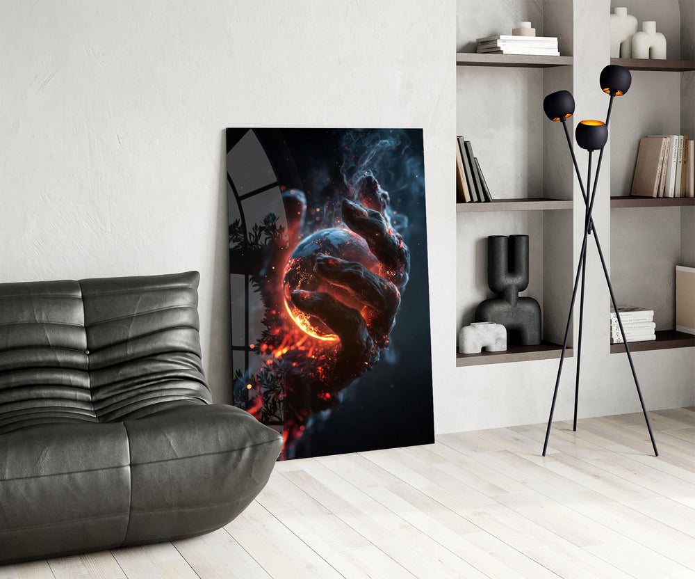 a molten stone hand cradling a glowing planet glass wall art leaning beside a dark leather sofa