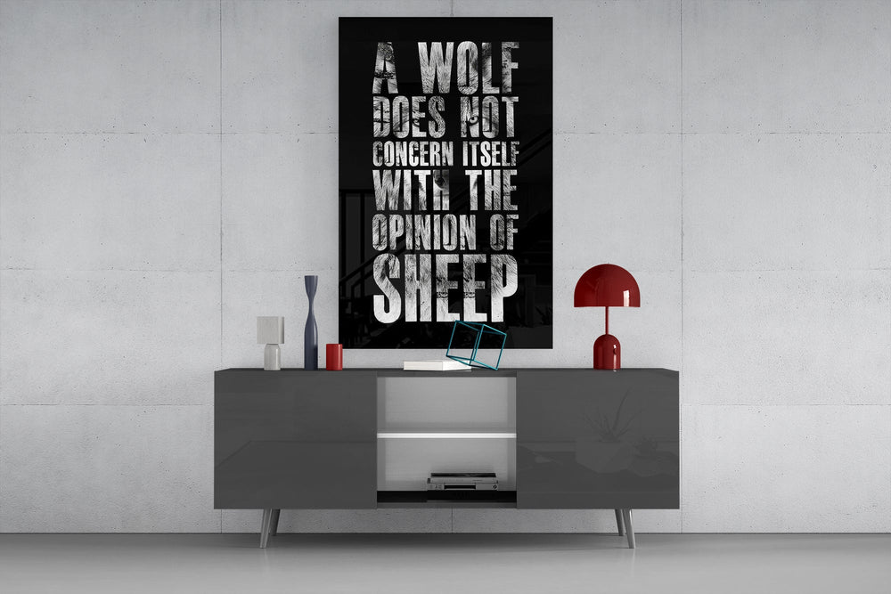 wolf opinion of sheep quote glass wall art displayed above a console in a designer interior