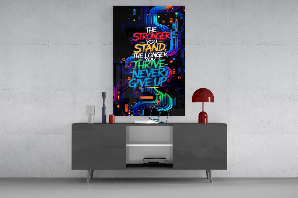 never give up neon graffiti quote glass wall art displayed above a console in a designer interior