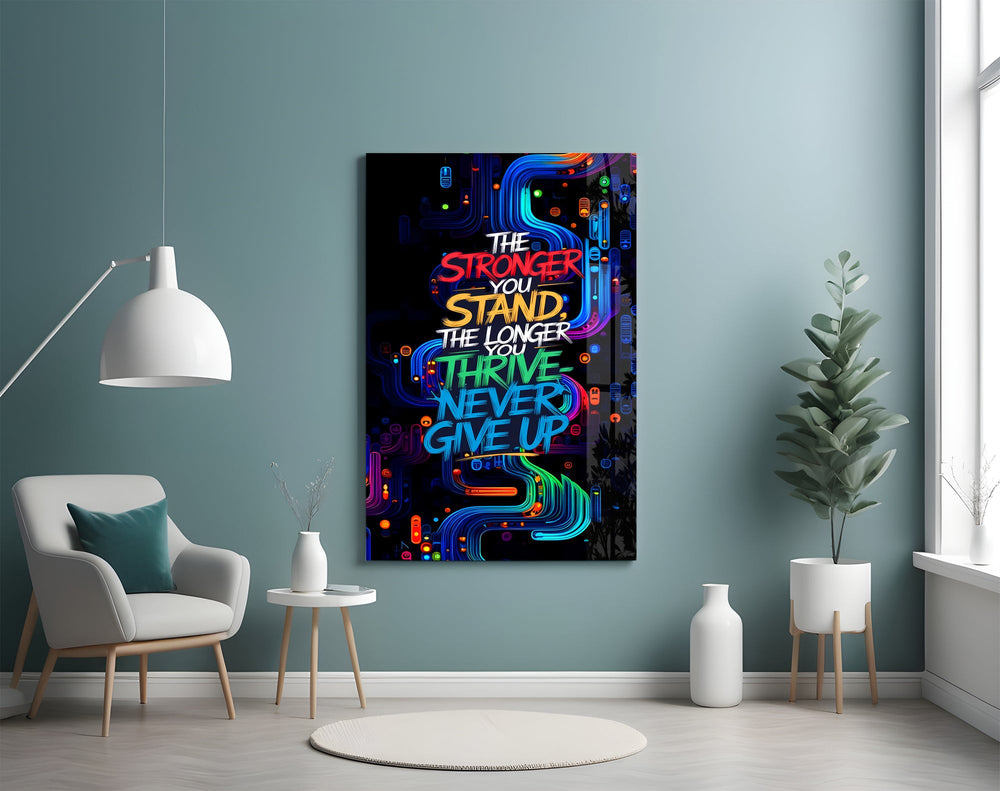 never give up neon graffiti quote glass wall art styled above an armchair in a reading corner