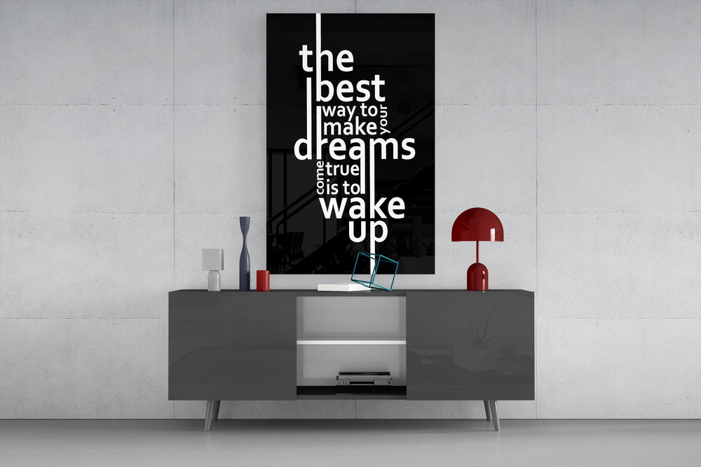 wake up dreams quote in black and white glass wall art displayed above a console in a designer interior