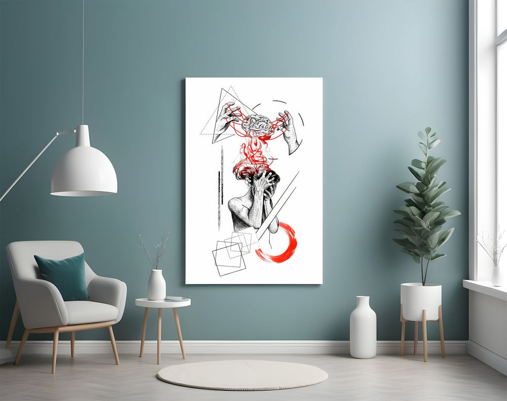 brain unravelling into red threads glass wall art styled above an armchair in a reading corner
