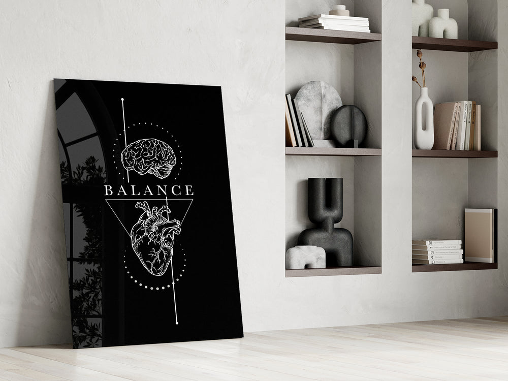 brain above heart balance on black panel resting in a shelving niche in a modern interior