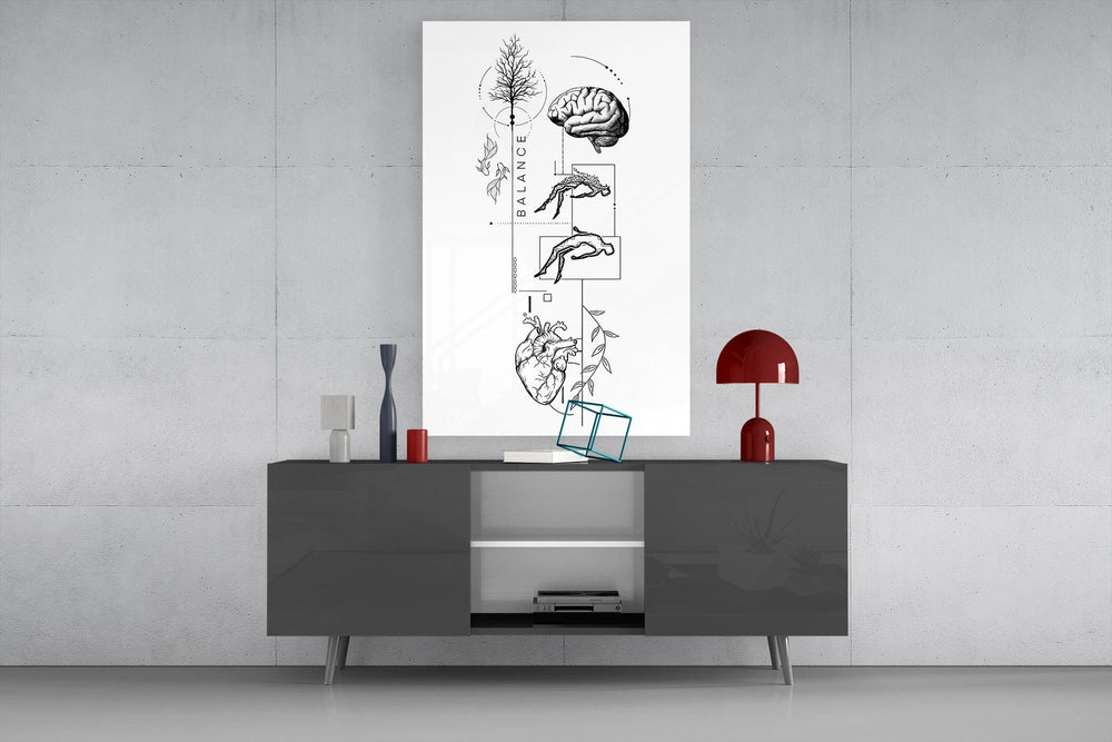 surreal balance collage of brain and heart glass wall art displayed above a console in a designer interior