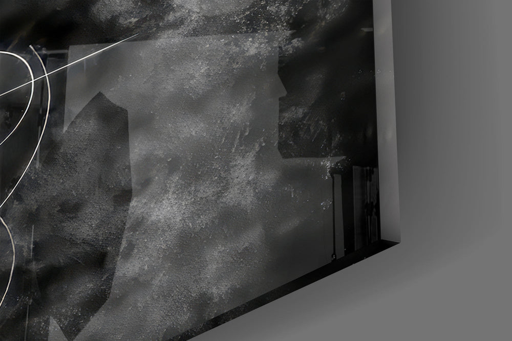Close-up detail of the feathered wings and classical marble figure against dark smoke on the glass surface