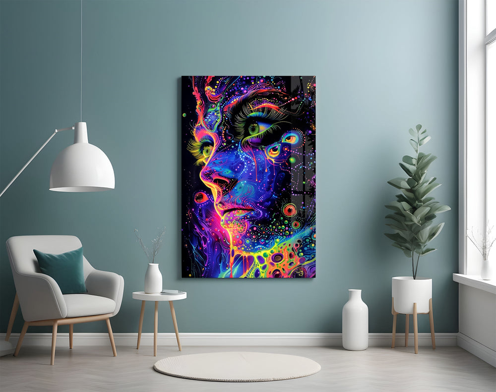 neon dot psychedelic woman's face glass wall art styled above an armchair in a reading corner