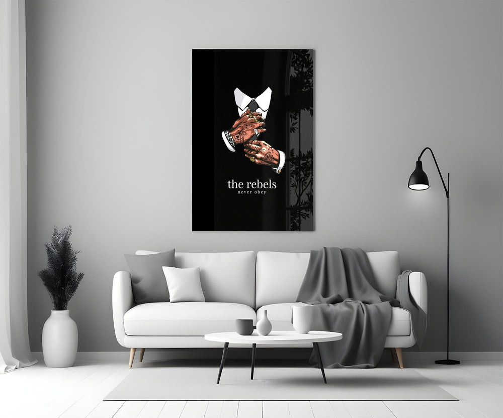 tattooed hands and the words the rebels never obey panel bringing character to a minimalist living room wall