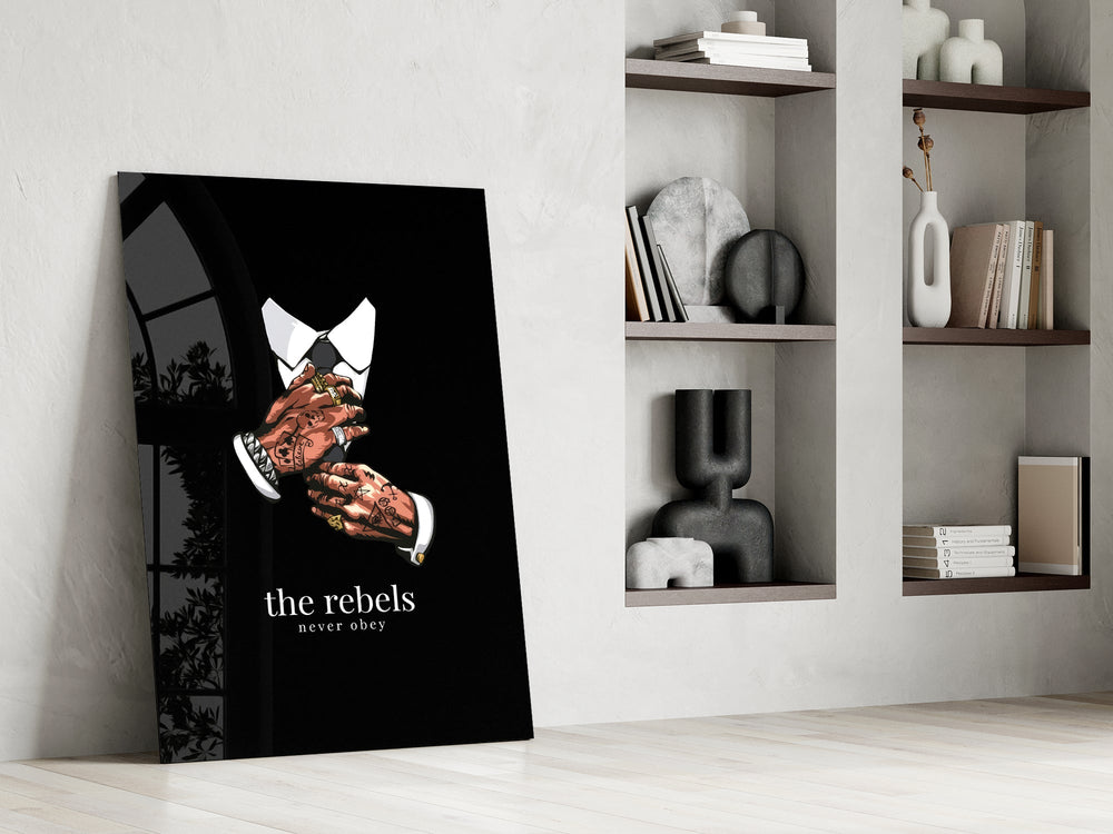 tattooed hands and the words the rebels never obey panel resting in a shelving niche in a modern interior