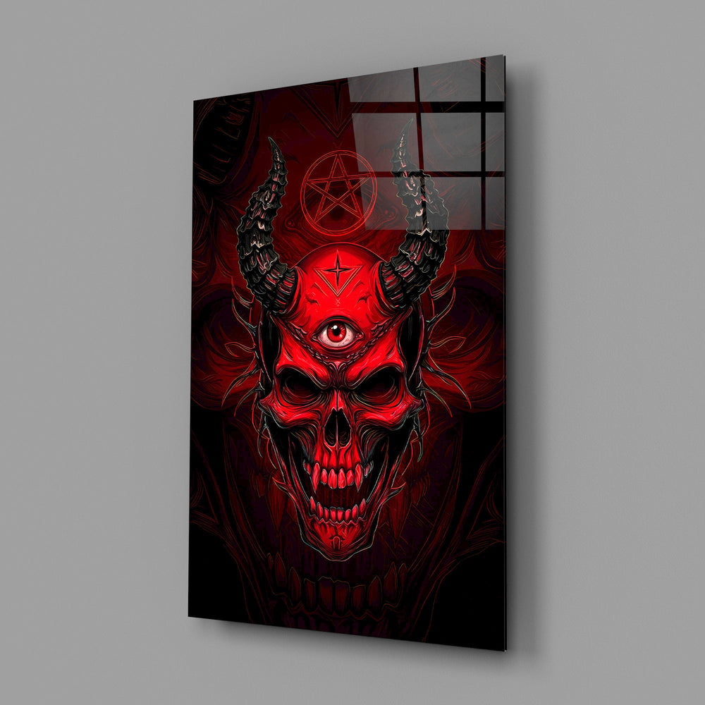 a red horned skull with a third eye glass wall art angled to show the polished tempered glass panel