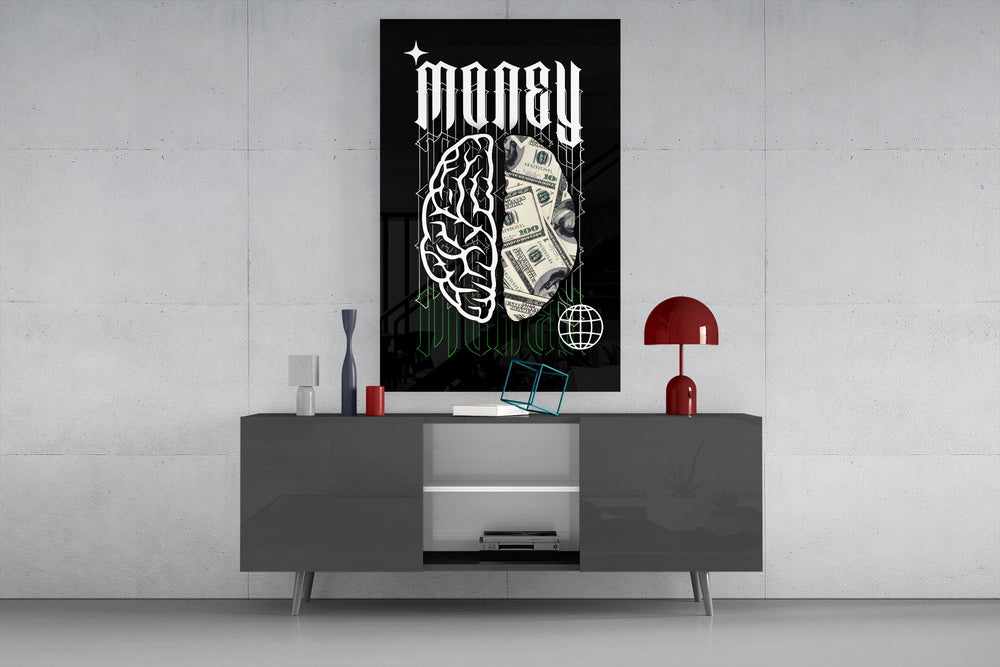 a brain half built from hundred-dollar bills glass wall art displayed above a console in a designer interior