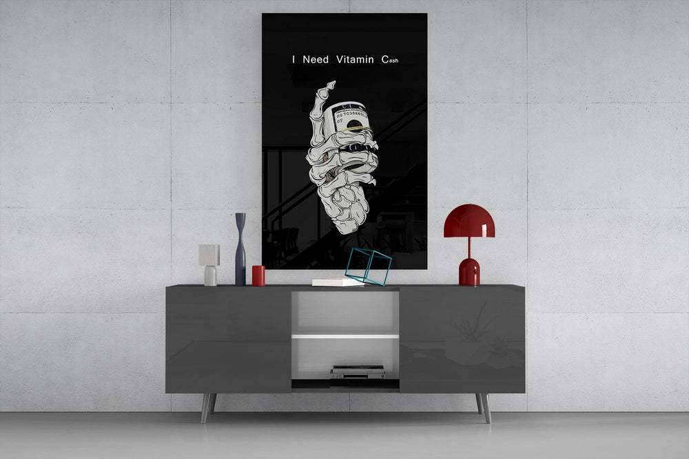 a skeleton hand gripping a roll of cash glass wall art displayed above a console in a designer interior
