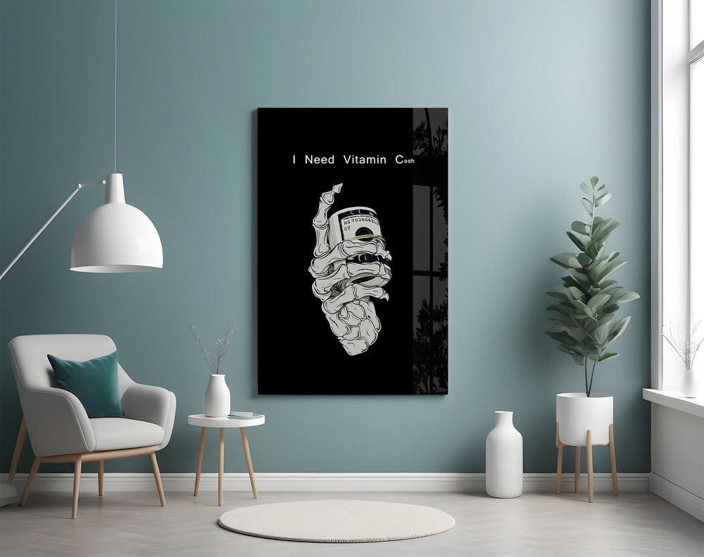 a skeleton hand gripping a roll of cash glass wall art styled above an armchair in a reading corner