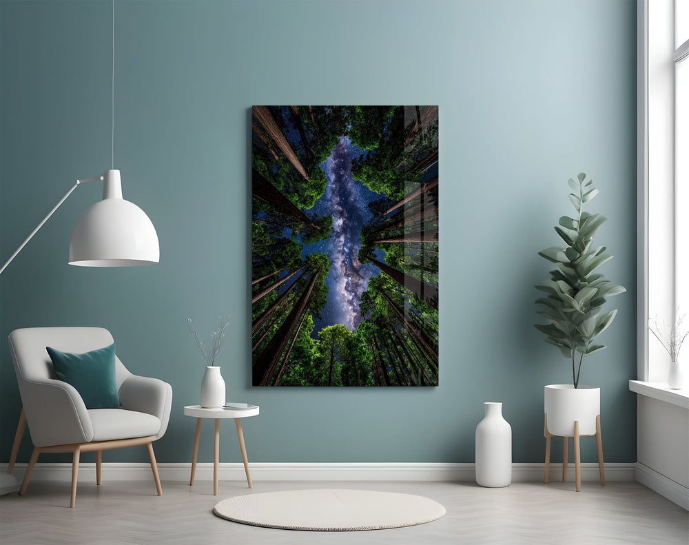 a redwood canopy opening to the Milky Way glass wall art styled above an armchair in a reading corner