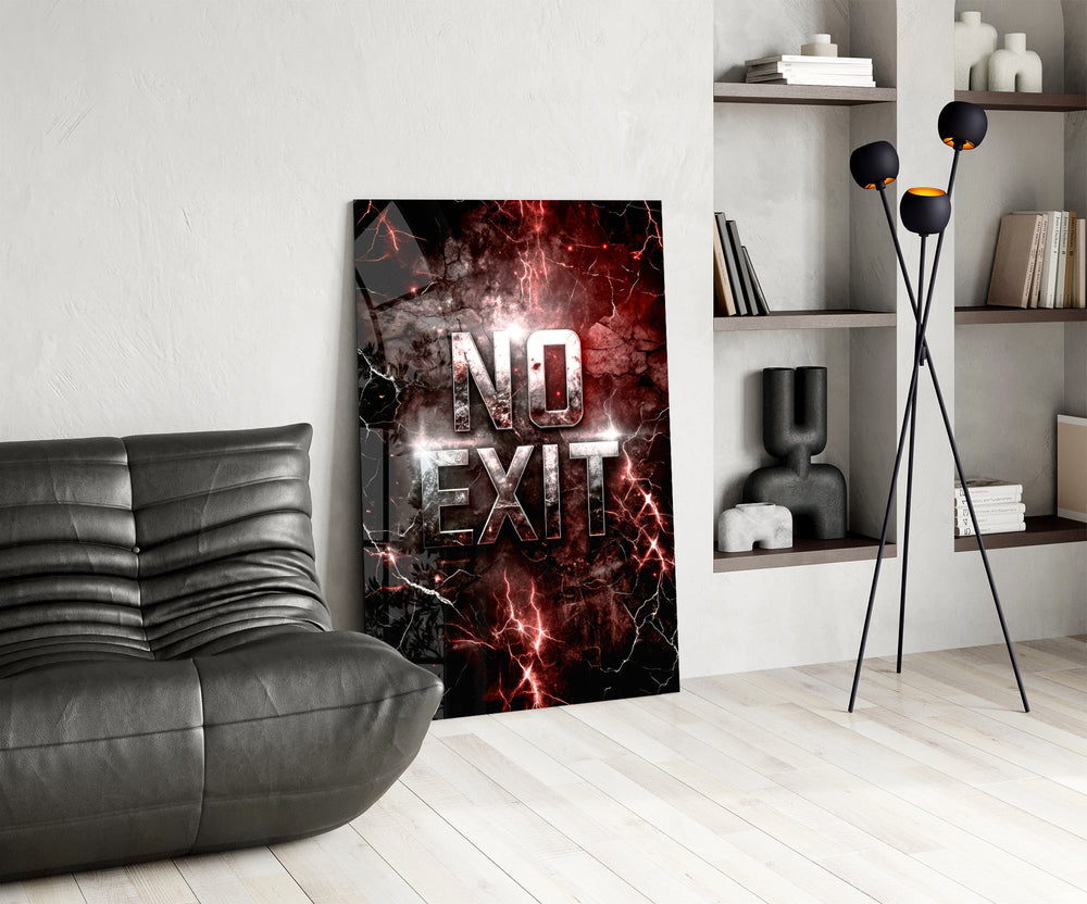 the words No Exit on cracked red stone glass wall art leaning beside a dark leather sofa