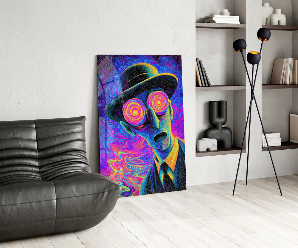 a wide-eyed man in a bowler hat glass wall art leaning beside a dark leather sofa